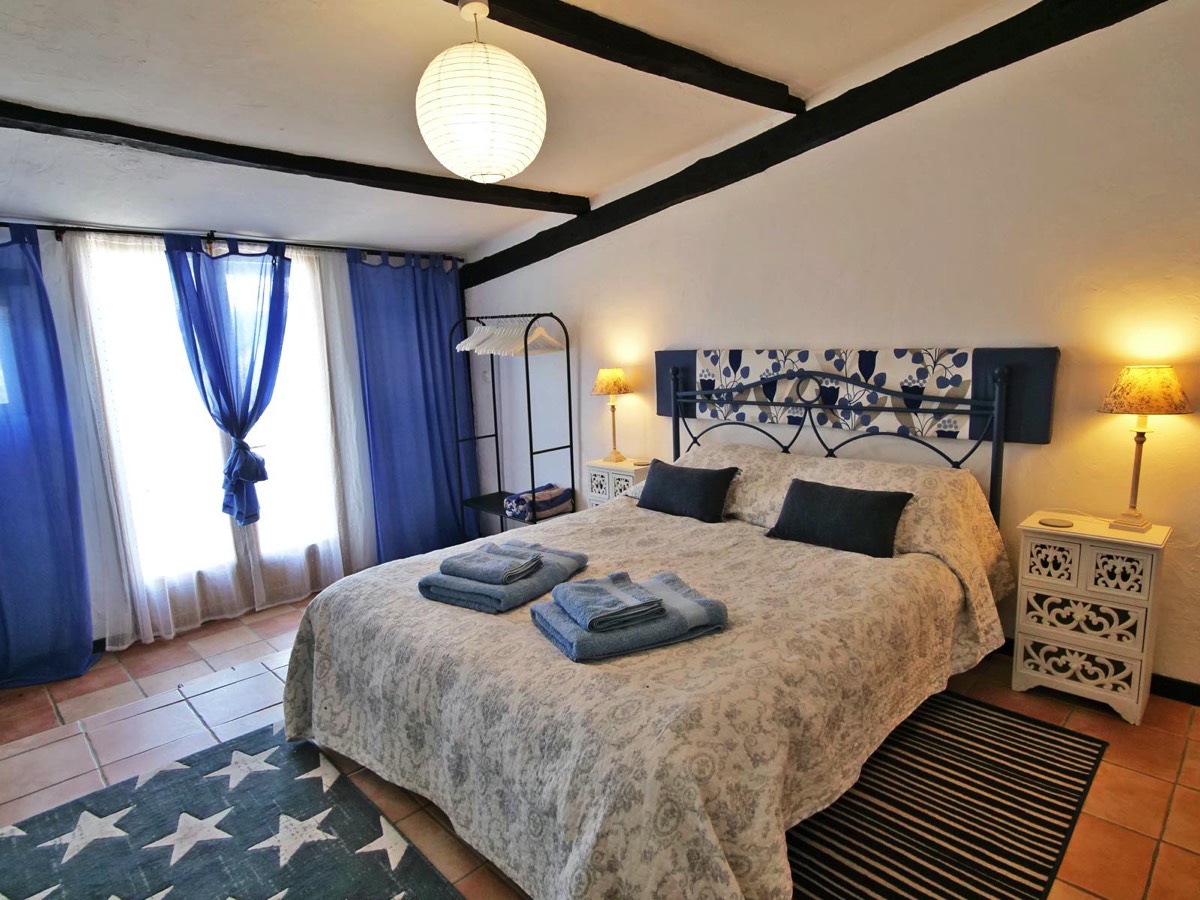 Large Double bedroom with access to the terrace at Garden View Gite