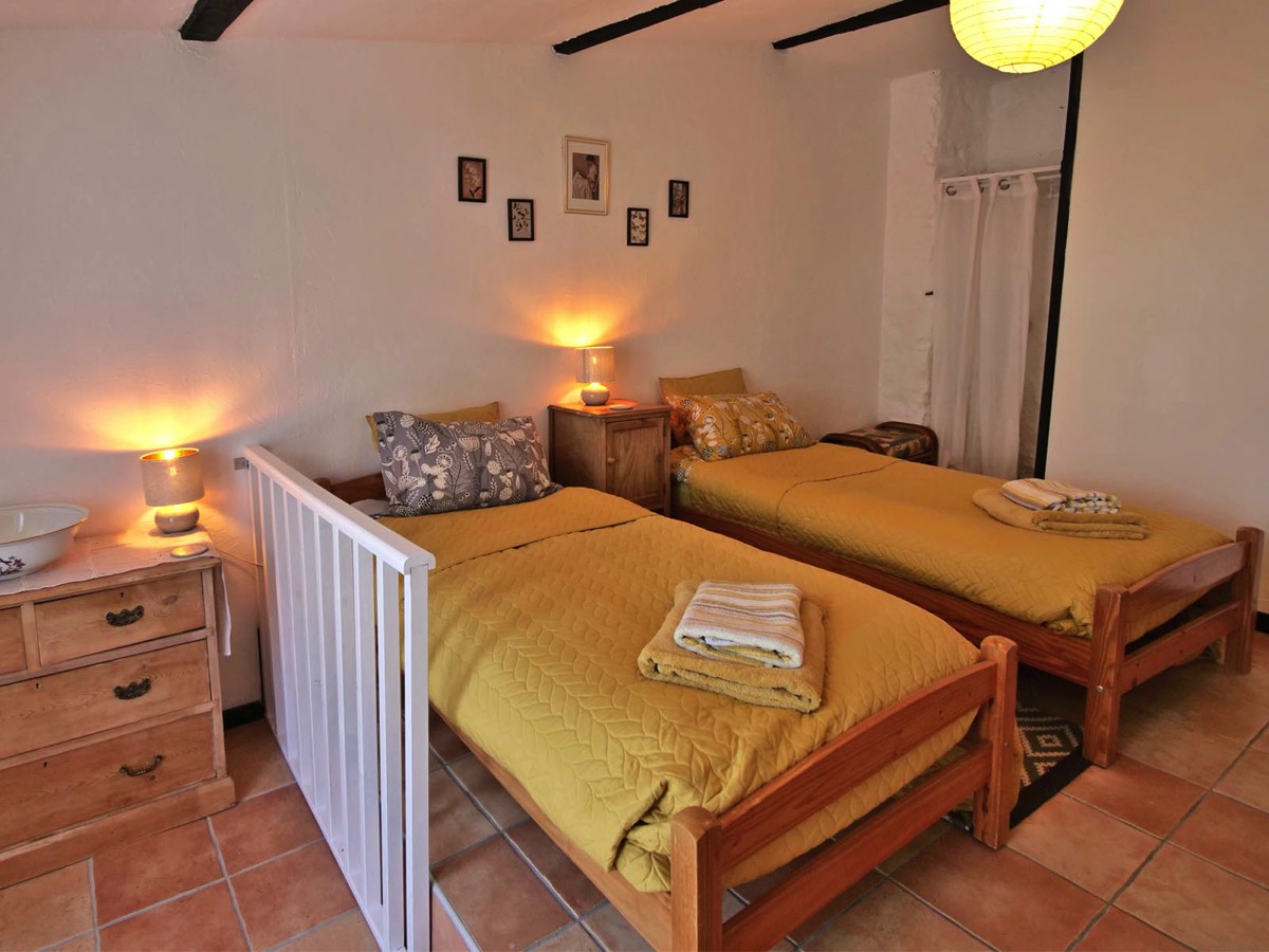 Twin Bedroom with direct access to patio terrace at Garden View Gite