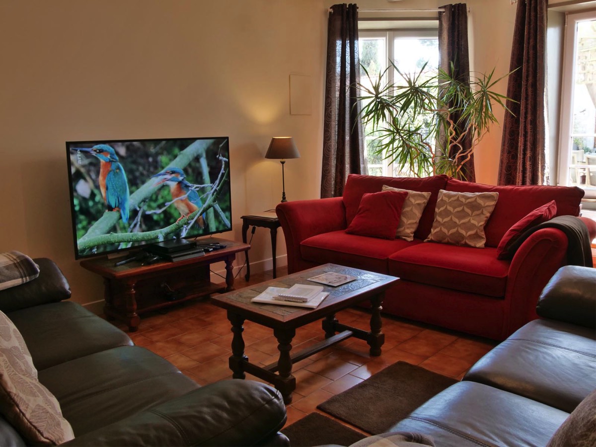 Comfy lounge with flat screen TV at Le Vieux Cafe