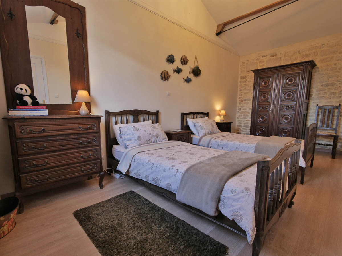 Twin Bedroom at L Ecurie Holiday Cottage