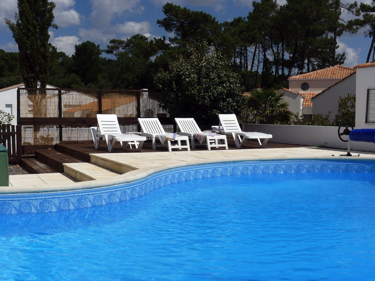 Sunbathe by the Pool at Les Pins du Phare Holiday Villa