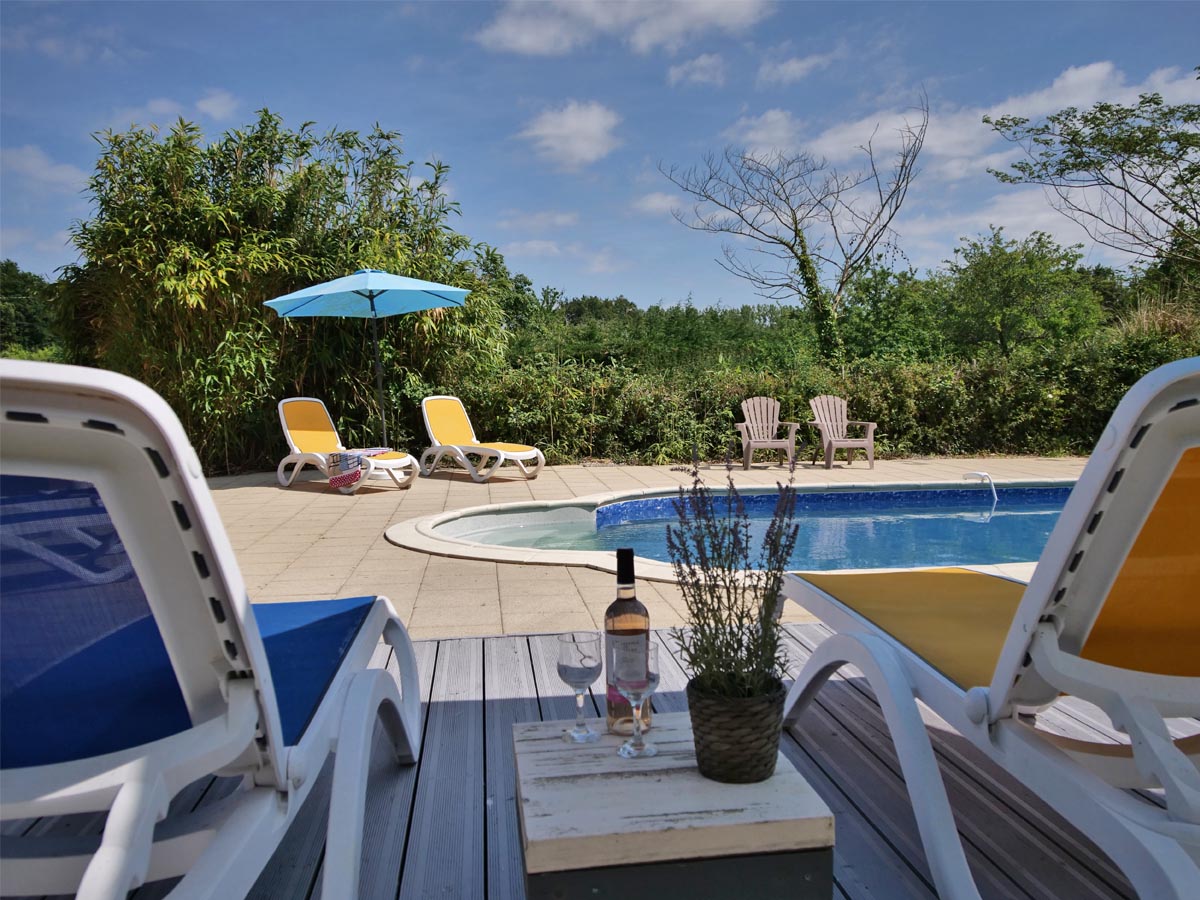 Relax by the pool at Orchard View Gite